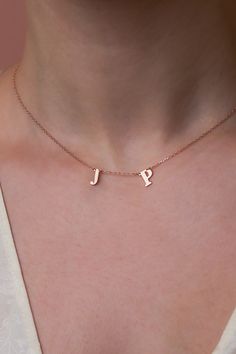 Wear your heart on your neckline with our 14k gold dainty monogram necklace. Thoughtfully designed to capture memories and moments, each initial pendant represents a story close to your heart. Whether a gift for a loved one or a treat for yourself, this necklace is a symbol of timeless connection. #TwoLetterNecklace Minimalist Initials Charm Necklace For Birthday, Minimalist Initial Necklace For Birthday And Mother's Day, Minimalist Anniversary Name Necklace With Initials, Dainty Initial Name Necklace For Everyday, Dainty Everyday Initial Necklace With Name, Dainty Personalized Initial Necklace For Birthday, Dainty Everyday Initial Necklace, Minimalist Initial Necklace For Birthday Or Valentine's Day, Simple Initial Necklace For Mother's Day Personalized Gift