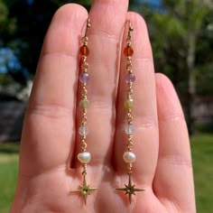 Crystal & Pearl Brass Star Earrings Crystals: Rhodonite, Amethyst, Lapis, Ocean Jasper  Made to order with genuine crystal & pearl beads & tarnish resistant, gold colored jewelry wire. Due to being made to order, the color & shape of each bead may slightly differ. #boho #earrings #handmadejewelry #jewelry #hippie #handmade #handmadejewelry #crystaljewelry #beads #boho labradorite crystal earrings threader dangly hippie earthy fairy core Minimalist Dangling Earrings, Gold Crystal Jewelry, Crystal Bead Jewelry Ideas, Bead Wire Earrings, Cristal Earring, Czech Glass Earrings, Crystals Rhodonite, Hippie Jewelry Diy, Fairy Core Jewelry