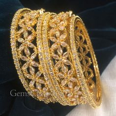 BEAUTIFUL CUBIC ZIRCON BANGLE *  Main Color : Gold * Skin Friendly : This Product does not contain harmful constituents. Anti-allergic safe for Skin. * Quality : Made from Premium Quality Material. This Product assures to remain in its Original Glory even after several usages.     . Actual Images of item are shown above, Please be aware of the actual colors may vary from the color shown on your screen, as monitor    settings may vary from individual to individual. . Welcome to Our Etsy Store! We Gold Bridal Sets With Intricate American Diamond Design, Cubic Zirconia Bangle For Wedding, Wedding Bangle With Sparkling Cubic Zirconia Stones, Hand Set Gold Plated Bracelets For Weddings, White Gold Plated Bracelets For Wedding, Gold Cubic Zirconia Wedding Bracelets, White Gold Plated Bracelet For Wedding, Wedding Gold-plated Hand-set Bracelets, Gold Plated Round Bangle For Wedding