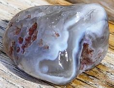 a piece of rock sitting on top of a wooden table