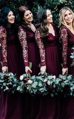 the bridesmaids are dressed in burgundy dresses with long sleeves and floral bouquets