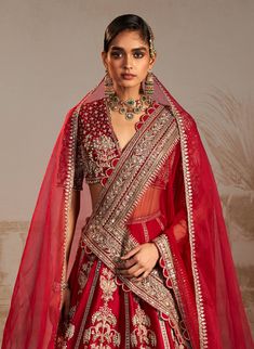 Embark on a journey of love with this red lehenga set, inspired by persian culture. The intricate tree motifs symbolize the emotions of a bride, elegantly crafted on a vibrant red lehenga, paired with a matching blouse and a scalloped-edged dupatta. Red, representing love and new beginnings, adds timeless elegance. Style with traditional accessories and step into your new life with grace, embracing the cultural significance of this enchanting ensemble. Traditional Accessories, Red Sari, Journey Of Love, Indian Bridal Lehenga, Persian Culture, Red Lehenga, Indian Bridal Dress, Elegance Style, The Emotions