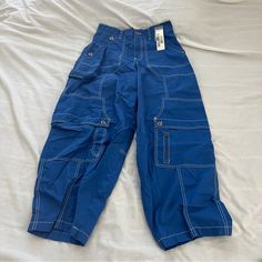 Urban Outfitters Blue Rih Baggy Carpenter Pants Size 2 Condition: Nwt Color: Blue Details : - Contrast Stitching - Comfy Extra: - I Ship Between 1-2 Days Baggy Blue Bottoms For Streetwear, Casual Blue Pants With Cargo Pockets, Blue Wide Leg Bottoms For Streetwear, Casual Blue Wide-leg Parachute Pants, Blue Baggy Cargo Pants With Pockets, Baggy Blue Cargo Pants With Pockets, Baggy Blue Cargo Pants, Casual Blue Bottoms With Belt Loops, Blue Wide-leg Pants For Streetwear