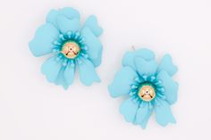 Make your fashion statement with these unique blue flower earrings. Crafted with precision and attention to detail, these earrings are sure to bring out your unique style and make you stand out from the crowd. An ideal accessory for any ensemble, these earrings will be sure to upgrade your fashion outlook. Care: To restore the luster and shine of your jewelry, use a jewelry cloth or soft cotton cloth to gently buff the piece. Size and Fit: 1.8 inches Blue Flower Earrings, Petal Earrings, Designer Party Dresses, Sustainable Fashion Brands, The Marine, Romper With Skirt, Sweater Set, Heeled Loafers, Blue Flower