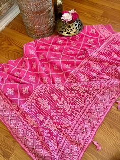 A very very pretty Chikankari saree in pure georgette in a lovely candy pink shade with all over jaal (barfi pattern) embroidery with mukaish work (embellishments). The pallu is short but features intricate designs. The entire saree has the same pattern from the very beginning of the saree except the portion you have to tuck in so that it doesn't bulge. Entire saree is framed in cord piping, best quality satin falls are attached and picot stitching is done as well. The blouse piece is separated Pink Saree With Intricate Embroidery, Pink Embroidered Saree, Pink Embroidered Georgette Saree, Pink Semi-stitched Saree With Intricate Embroidery, Traditional Pink Saree With Resham Embroidery, Pink Traditional Wear With Intricate Embroidery For Ceremonies, Pink Saree With Intricate Embroidery For Diwali, Festive Pink Saree With Intricate Embroidery, Pink Traditional Wear With Chikankari Embroidery