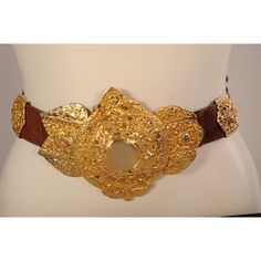 This supple brown leather belt is embellished with a large gold toned buckle and seven decorative slides in two different styles. The belt is stamped  Made in Italy by Roberta Di Camerino Expressly for Saks Fifth Ave. It is in excellent condition and appears unworn. Measurements; Belt  Length 32" Width 1 3/8" Buckle Height 5"  Please see the measurements noted above in the description for best approximate dimensions Designer Brown Belt Buckles With Removable Belt, Gold Chain Belt With Removable Feature For Formal Occasions, Formal Gold Chain Belt With Removable Feature, Designer Gold Belt For Evening, Designer Brown Belt Buckles With Gold Buckle, Designer Brown Belt Buckles, Luxury Brown Belt With Brass Buckle, Elegant Gold Leather Chain Belt, Designer Gold Belt Buckles With Brass