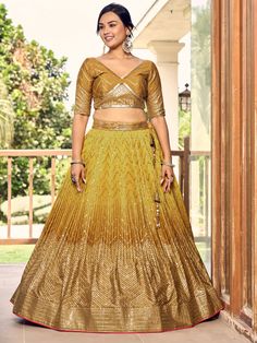 Introducing our outstanding yellow sequins chinon haldi wear lehenga choli, a stunning ensemble perfect for weddings, functions, and other ethnic occasions. This beautiful set includes a yellow color chinon material lehenga with intricate thread embroidered work and sequin embellishments, a matching chinon material choli also adorned with thread embroidery and sequin work, and a light yellow net dupatta with sequin work and attractive lace border detailing.
The semi-stitched lehenga can be adjus Yellow Chinon Sets For Wedding, Yellow Chinon Traditional Wear For Reception, Yellow Georgette Choli For Navratri, Gold Lehenga With Mirror Work In Georgette, Fitted Gold Anarkali Set In Georgette, Gold Fitted Anarkali Set In Georgette, Fitted Gold Georgette Anarkali Set, Yellow Georgette Choli For Festivals, Gold Georgette Sets For Festivals