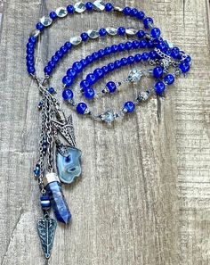 This is a beautiful one of a kind beaded blue stone and crystal charm necklace. Semi precious Stones. Crystal charm. This necklace is made 36 inches long and has an adjustable silver chain. Beaded charm necklace.  Necklaces can be made any size, color or style. Please send me a message if you would like a certain size, color, or style made especially for you!  Thank you for visiting and shopping 27inHeaven! ❤️ Michelle Hoeft Blue Beaded Crystal Necklace, Blue Beaded Necklaces With Stones For Jewelry Making, Bohemian Sapphire Necklaces With Natural Stones, Blue Crystal Beaded Necklaces For Jewelry Making, Blue Gemstone Beads For Long Necklace, Blue Crystal Jewelry With Gemstone Beads, Bohemian Blue Czech Glass Necklaces, Blue Beaded Necklaces With Stones For Healing, Blue Beaded Chain Crystal Necklace For Jewelry Making