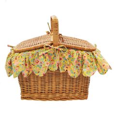 a wicker picnic basket with floral fabric