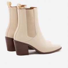 A unique Chelsea boot. Inspired by cowboy boots and western styling, the Bianca Chelsea Boots kick things up a few notches. The semi square toe box, alluring Cuban heel and sculptural shape create a captivating silhouette that will attract the right kind of attention. With a contemporary look and feel, the Biancas love to have fun, and play well with your casual outfits and dressy ensembles. Go ahead, take them for a whirl. This product is made from Gold Rated full-grain calfskin leather sourced Western Chelsea Boots With Stacked Heel For Fall, Western Mid-calf Boots With High Stacked Heel, Western High Ankle Boots With Reinforced Heel, Western Chelsea Boots With Stacked Heel, Western Chelsea Boots With Stacked Heel And Round Toe, Pointed Toe Mid-calf Boots With Reinforced Heel For Rodeo, Western Boots With Stacked High Heel, Fall Chelsea Boots With Stacked Heel And Square Toe, Western Mid-calf Boots With Stacked Block Heel