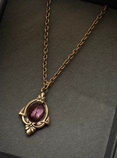 Aria Antique Gold Amethyst Necklace February Birthstone - Etsy Luxury Purple Heirloom Necklace, Vintage Gold Pendant Crystal Necklace, Vintage Gold Crystal Pendant Necklace, Art Deco Brass Jewelry With Vintage Charm, Brass Art Deco Jewelry With Vintage Charm, Antique Gold Necklaces With Vintage Charm And Oval Pendant, Antique Gold Necklace With Vintage Charm Oval Pendant, Antique Gold Necklace With Oval Pendant And Vintage Charm, Antique Gold Oval Pendant Necklace With Vintage Charm