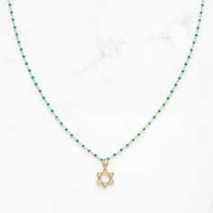 "Dainty Star of David necklace on sterling and gold plated, enamel beaded chain.  Adjustable 16-18\"	in stock	45.00 USD	"	4.00 USD	Jewelry > Necklaces > Charm Necklaces
"	top_seller_high	false	https://www.etsy.com/listing/1584979972/star-of-david-magen-david-necklace-for	adult	etsy://listing/1584979972?ref=applinks_android	stitchandstonedesign	Black	new	en-US	"	false	unisex	0.67	Apparel & Accessories > Jewelry > Necklaces	https://i.etsystatic.com/6649757/r/il/b16bbe/5451198694/il_fullxfull.54511 Star-shaped Beaded Chain Necklace For Gift, Star-shaped Beaded Necklace For Gift, Gold Necklaces With Star Charm And Round Beads, Gold Necklace With Star Charm And Round Beads, Star-shaped Jewelry With Beaded Chain For Gifts, Magen David Necklace, Star Of David Necklace, Necklace Top, Enamel Beads