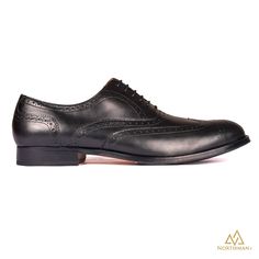 The Vega by Northman+ is a full brogue on the elegant Sleek N+EurX last and a great example of fine Indian shoe-making , handmade from the finest leather by the skilled artisans at Northman+ . Although some see brogues as weekend shoes, these black brogues can actually add a lighter more summery note to grey suiting / office wears. What you see is 100% Handmade Product, did we mention about that comfortable Insole we provide in these shoes? You can stand all day at your work and your feet will t Elegant Wingtip Oxfords With Goodyear Welt, Business Wingtip Oxford Shoes With Goodyear Welt, Timeless Wingtip Oxford With Goodyear Welt, Timeless Formal Oxford Shoes With Brogue Detailing, Timeless Goodyear Welted Wingtip Oxford, Timeless Formal Oxford With Brogue Detailing, Business Wingtip Oxford With Leather Sole, Formal Wingtip Oxford With Leather Sole, Wingtip Oxford With Leather Sole For Formal Occasions