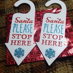 two christmas tags with santa's please stop here and snowflakes on them