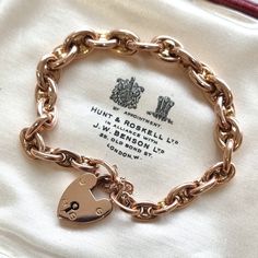 "This beautiful antique piece is a subtle twist on the classic curb \"charm\" bracelet, featuring anchor links instead, fastened by a traditional heart shaped padlock and secured with a safety chain, all mounted in 9ct rose gold. Circa 1900. Padlock stamped \"9CT\". Bracelet tested as 9ct. The bracelet measures approximately 190mm (L) x 7.2mm (W). The approximate weight is 13.5 grams. Please note that the antique box is for display purposes only. Thank you. CONDITION: In very good antique condition, with minimal surface wear commensurate with age. The padlock functions perfectly. LAYAWAY: We happily offer layaway/deposits on the majority of our items. Please send us a message if you would like to arrange a layaway. Layaways are not available on sale items. SHIPPING: All items are packed in Classic Charm Bracelet With Curb Chain As Gift, Classic Curb Chain Charm Bracelet As A Gift, Classic Charm Bracelet With Vintage Charm As Gift, Classic Oval Link Charm Bracelet Gift, Classic Oval Link Charm Bracelet As Gift, Classic Oval Link Charm Bracelet For Gift, Vintage Oval Link Gold Bracelet As Gift, Traditional Heart, Minimal Surface