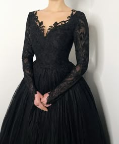 Orders for 2022 September - December are still being accepted! If you need the dress by September, October please choose express shipping! Made to order!! All black lace wedding gown. The skirt is made of many many layers of soft black tulle and the top layer is soft black lace. Bodice and long sleeves dekorated with a different yet matching lace. Hidden zipper closure and little black buttons. After you place the order, I will contact you and send the list of measurements I need. Along with ins Black Lace Prom Dress With Sleeves, Black Wedding Gowns Plus Size Formal, Chotronette Dresses Black, Black Prom Dress Long Sleeve Lace, Dark Theme Wedding Dress, Organza Dress Black, Satin Black Wedding Dress, Black Wedding Dress Sleeves, Simple Black Wedding Dress With Sleeves