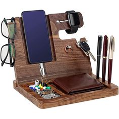 a wooden desk organizer with pen, glasses and cell phone