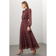 Red floral cotton (100% Silk). Lining (100% Polyester). A-line. Long sleeves. Mock neck. Back zipper closure. 55" from shoulder to hemline. Imported. Flowy A-line Maxi Dress For Fall, Fall Midi Dress With Ditsy Floral Print, Fall Midi Length Ditsy Floral Print Dress, Chic Ditsy Floral Print Dress For Fall, Fall Ditsy Floral Print Maxi Dress, Feminine A-line Maxi Dress For Fall, Fall Floral Dress With Ditsy Print, Fall Floral Dress With Ditsy Floral Print, Fitted Maxi Floral Dress For Fall