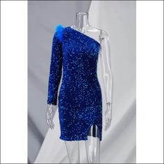 This exquisite Sequin Feather One-Shoulder Chained Up Mini Dress will add a touch of luxury to any special occasion. An eye-catching combination of sequins and feathers make for a truly unique design. The addition of a chain detail along the side and a mini dress silhouette make for a bold and glamorous look. Decoration Sequined , Feathers Length Above Knee, Mini Style Sexy & Club Fabric Type Sequin , Blended fabrics , Mesh Material Polyester , Spandex Neckline One Shoulder Pattern Type Patchwor One Shoulder Party Dress With Feather Trim, Blue Feather Trim Dress For Night Out, Blue One Shoulder Party Dress, Blue One Shoulder Dress For Prom Cocktail, Glamorous Blue One-shoulder Prom Dress, Blue One Shoulder Dress For Prom Party, Blue One-shoulder Dress For Prom Party, Blue One-shoulder Dress For Prom Season Party, Glamorous Blue One Shoulder Evening Dress