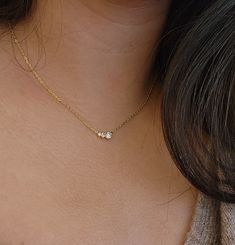 Discover the elegance of our jewelry, where each piece is meticulously designed to suit your style. Celebrate special moments with our beautifully crafted for bridesmaid gifts, and enhance your charm with this modern gold necklace. Express your unique style and layer the necklace to elevate your look! This three stone necklace exudes chic simplicity, and adds a touch of sophistication. Explore the allure of timeless pieces in our collection, and complete your look with the loveliness of our intr Delicate Charm Necklaces For Bridesmaid Gift, Minimalist Hypoallergenic Diamond Jewelry, 14k Gold Round Pendant Charm Necklaces For Wedding, 14k Gold Round Pendant Charm Necklace For Wedding, Elegant Adjustable Necklace For Anniversary, Rose Gold Wedding Charm Necklace, Elegant Hypoallergenic Necklaces For Mother's Day, Elegant Hypoallergenic Jewelry For Mother's Day, Elegant Yellow Gold Hypoallergenic Charm Necklace