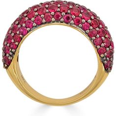 Looking for a statement piece that will turn heads? Look no further than this stunning Small Dome Ring in Ruby by Piranesi. With approximately 3.0 carats of round rubies, this ring is sure to catch the eye of anyone who sees it. The rubies are set in a unique combination of 18K yellow and black gold, creating a bold and elegant contrast that is truly one of a kind.Not only is this ring a beautiful piece of jewelry, but it also speaks to the desires of our target market. Women who buy fine jewelr Luxury Red Ring With Pave Setting, Ruby Rings With Pave Setting, Yellow Gold Ruby Rings With Pave Setting, Oval Ruby Ring With Pave Setting, Luxury Ruby Diamond Ring With Pave Setting, Ruby Ring With Pave Setting, Ruby Ring With Pave Setting As Gift, Luxury Ruby Gemstone Ring, Red Rings With Pave Setting