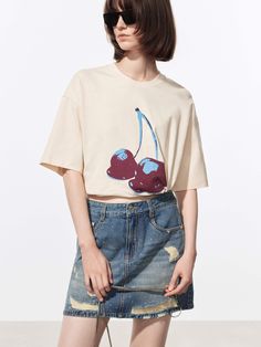 MO&Co. Women's Cherries Pattern Cotton T-shirt This t-shirt is made from soft and comfortable cotton fabric for a cozy feel. It features a slightly oversized fit with a drop-shoulder design for a relaxed and casual look. The front of the shirt is adorned with a cherry print design for a playful and fun touch. This t-shirt is perfect for wearing on a lazy weekend or pair with jeans for a casual outing. Features : - Slightly oversized fit- Crewneck and drop shoulder- Cherries print design Code: MB Lazy Weekend, Cherry Print, Printed Jeans, Feel It, Shoulder Design, Cotton T Shirt, Drop Shoulder, Casual Looks, Cotton Tshirt