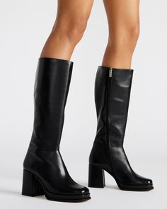 Crafted for ultimate sophistication, these knee-high boots boast a sleek square toe and sturdy block heel for effortless style. Elevate your wardrobe with the MYSTERY platform boot. 3.25 inch heel height 1 inch platform Size 6 measurements: 14 inch shaft circumference, 14.25 inch shaft height Size 8 measurements: 15.5 inch shaft circumference, 15 inch shaft height Size 10 measurements: 16 inch shaft circumference, 15.5 inch shaft height Leather upper material Textile and synthetic lining Synthet