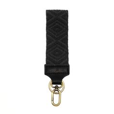 a black and gold belt with a metal hook in the middle on a white background