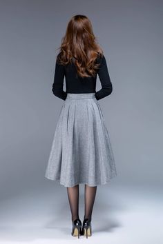 "A short wool skirt for autumn, winter. A simple work skirt. DETAIL * 30% wool, 30% fiber, 40% polyester * fully satiny lining, more nice to the touch body * Seam pocket * Right zipper closure * Below knee length * Wash by hand or machine with cold water SIZE GUIDE Size vary between Brand and Country Please get your body measurement with our Size Guide And Find your size in our Size Chart Size Guide https://www.etsy.com/listing/722950722 SIZE CHART https://www.etsy.com/listing/736810337 This Vid Elegant Winter Midi Length Pencil Skirt, Elegant Midi Length Pencil Skirt For Winter, Elegant Gray Flowy Skirt, Flared Skirt For Workwear In Fall, Elegant Knee-length Skirt For Fall, Fall Midi-length Lined Pencil Skirt, Fall Midi Length Lined Pencil Skirt, Full Skirt For Workwear In Fall, Fall Office Midi-length Pencil Skirt