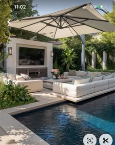 an outdoor living area with a pool and patio furniture