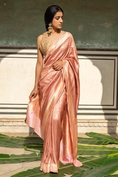 Blush pink silk banarasi saree with all over textured chevron pattern and broad metallic border. Comes with running blouse piece.
Components: 1
Pattern: Woven
Type Of Work: Chevron Pattern
Fabric: Silk Banarasi
Color: Maroon
Other Details: 
Note: The stitched blouse worn by the model is not for sale
Disclaimer: The joint fabric pieces may vary. Designers unique process ensures that the placement of fabric will always be similar but not same. They always create the product with stretch fabrics of Pastel Banarasi Lehenga, Simple Banarasi Saree, Pastel Color Saree For Wedding, Pastel Banarasi Saree, Blush Saree, Pastel Saree, Pink Silk Saree, Pattu Silk Saree, Wedding Guest Outfit Inspiration