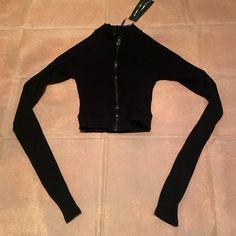 As Part Of The Jodie Joe Line, This Mock Neck Long Sleeve Top Has Stretch, Compression Rib, Thumbholes And An Invisible Front Zip. Rayon And Spandex Blend. Retails For $27.99. New With Tags. Message Me For Any Questions Casual Crop Top For Club In Fall, Edgy Stretch Crop Top For Winter, Edgy Winter Stretch Crop Top, Edgy Black Elastane Tops, Black Stretch Tops For Club, Trendy Solid Color Top With Zipper Closure, Trendy Solid Tops With Zipper Closure, Stretch Tops With Zipper Closure For Winter, Stretch Tops With Zipper Closure For Fall