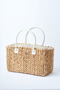 Because you fell in love with our Fullerton straw bag, we designed a second version. Buttery ivory leather, slightly smaller size and the same amazing handwoven hyacinth natural straw. This tote is topped off with a linen draw cord closure to keep your belongings secure. Fill it up with your favorite sun or pool essentials or take it to lunch. Content:Hyacinth StrawImported Size:Width: 15.5"Height: 9"Depth: 7.5"Handle Drop: 7.5" Pool Essentials, Straw Tote Bag, Straw Tote, St Augustine, Tote Bag Leather, Fell In Love, Leather Handle, Straw Bag, Leather Bag