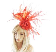 Hats By Cressida Kentucky Derby & Ascot Fascinator Hats Spring Summer Hat & Fascinator Collection A mass of of red & peach feathers surround a red rose Main body about 6-7 inches wide, bigger with the long wispy feathers Mounted with a matching headband. If you prefer a headband to match your hair, please make a note at check out what colour headband you want. We make each hat to order and can add or change colours just email us with what you need.  We can also make a custom design for you if yo Red Feathered Costume Hat For Races, Red Feathered Hat For Races, Red Feathered Fascinator For Kentucky Derby, Red Headband For Carnival Party, Carnival Red Party Headband, Red Mini Hats For Party Carnival, Red Mini Hats For Carnival Party, Carnival Party Red Mini Hats, Red Headband Hat For Wedding