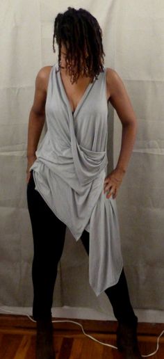 Gray drape top is one of my new tops. You can wear a sports bra under,bikini top,tank top. If you would like the arm hole smaller, please let me know. I love draping tops, because they are stylish for any age,funky,chic and fun to wear. You can wear leggings,skinny jeans or over any plain dress or skirt. The fabric in the picture is rayon Lycra (light weight). I can also make it in ity jersey which is wrinkle free and easy to care for. Every piece of clothing in my shop is made and designed by m Draping Top, Grey Drapes, Drape Top, Plain Dress, Draped Top, Chic And Elegant, Elegant Blouses, Top Tank, New Tops