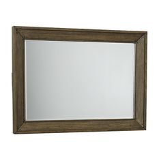 a wooden framed mirror on a white wall with clippings to the bottom edge