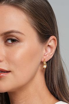 Description Get ready for a captivating night out with our Anuket 18k Gold C Hoop Earrings. Adding a pop of red lipstick, slip into a chic black dress, and put on a dainty gold necklace. The finishing touch? These exquisite C hoop earrings that effortlessly blend sophistication and modern charm. Step into the night with confidence, turning heads and making a statement with your radiant style. Material Handpicked shell pearls: Crafted from shell powder, these pearls undergo a meticulous process t Chic Yellow Gold Hoop Earrings For Party, Gold Plated Elegant Hoop Earrings, Gold Plated Hoop Earrings With Elegant Design, Elegant Gold Plated Hoop Huggie Earrings, Elegant Gold-plated Hoop Earrings, Elegant Small Hoop Huggie Earrings For Party, Chic Gold Plated Small Hoop Huggie Earrings, Chic Small Hoop Gold Plated Huggie Earrings, Gold Chic Huggie Earrings For Formal Occasions