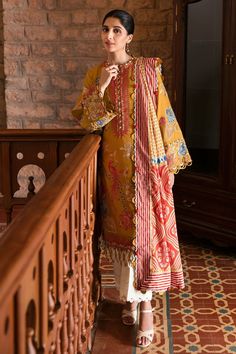 Brand: ZAHA by Khadijah ShahProduct Code: ZZF23-02 DERINCollection: ZAHA Festive Lawn Unstitched Spring Summer CollectionFabric: Lawn DESCRIPTION: Resplendent in an opulent marigold hue, ‘Derin' is truly a masterpiece adorned with ethereal floral embroideries that dance upon its fabric in a captivating symphony of scarlet, pumpkin, azure, and salmon hues, accentuated by celestial tinges of ivory. This vibrant chic shirt exudes an air of drama, heightened by its meticulously crafted borders adorn Zara Shahjahan Lawn, Mawra Hocane, Alkaram Studio, Gul Ahmed, Chic Shirts, Pakistani Actress, Fabric Stores Online, Best Wear, Pakistani Fashion