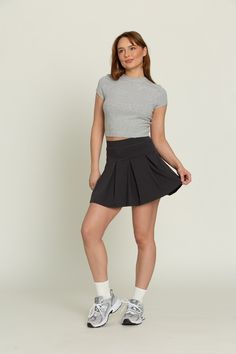 Our Off-Black Wide Pleat Tennis Skirt is a freshly designed take on our famous pleated tennis skirt. The wide pleats provide more length than the original pleated skirts and add a touch of sophistication to any outfit. It features built-in spandex shorts that include a comfortable fit and side pockets for storage. Tenis Skirt Outfits Black Summer, Tenis Skirt Outfits, Checked Skirt Outfit, Black Tennis Skirt Outfit, Black Tennis Skirt, Checked Skirt, Tennis Skirt Outfit, Pleated Tennis Skirt, Tennis Skirts