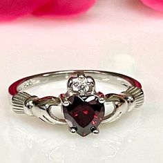 925 Sterling Silver Claddagh Irish Garnet Cz Ring * Metal :925 Sterling Silver * Stone :Grade Aaa Cubic Zirconia *Shape Heart 6mm *Design :Claddagh Irish Promise Rung * Color :White Gold Rhodium For Anti Tarnish. Irish Wedding Rings, Claddagh Ring Wedding, Garnet Wedding Rings, Garnet Wedding, Gothic Engagement Ring, Irish Ring Claddagh, Irish Rings, Garnet Heart, Irish Claddagh