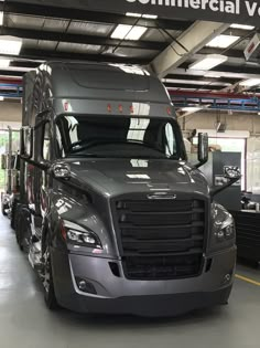 a semi truck is parked in a garage