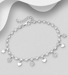 925 Sterling Silver Heart Bracelet, Decorated with CZ Simulated Diamonds Width: Heart: 3/16 inches Height: Heart: 1/4 inches Silver Heart Cut Bracelets For Valentine's Day, Sterling Silver Bracelet For Wedding On Valentine's Day, Sterling Silver Heart Bracelet For Anniversary, Elegant Adjustable Sterling Silver Bracelet With Heart Charm, Diamond Accented Bracelets For Valentine's Day Wedding, Sterling Silver Bracelet With Sparkling Stones For Anniversary, Sterling Silver White Gold Heart Bracelet For Wedding, Dainty Heart Bracelet With Cubic Zirconia, Wedding Bracelets With Diamond Accents For Valentine's Day