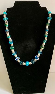 Beautiful handmade statement necklace. One Of A Kind Adjustable Necklace For Parties, Blue Distinctive Necklaces For Party, Blue Necklaces With Unique Variations For Parties, Unique Czech Glass Jewelry For Party, Blue Necklace With Unique Variations For Party, Handmade Turquoise Necklace In Czech Glass, Turquoise Glass Necklaces For Party, Turquoise Czech Glass Jewelry For Party, Turquoise Glass Necklace For Party