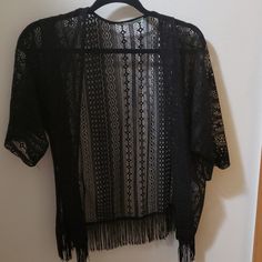 Black Womens Lace Top. Never Worn. Chic Black Beach Cardigan, Black Summer Cardigan For Day Out, Chic Black Cardigan For Day Out, Casual Black Cardigan For Beach, Casual Black Cardigan For The Beach, Black Spring Cardigan For Night Out, Black Open Front Cardigan For Night Out, Black Cardigan For Spring Night Out, Black Open Front Cardigan For Summer