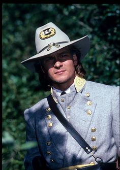 a man dressed in an uniform and hat