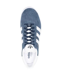 signature three-stripe sneakers from adidas featuring navy blue, white, leather, front lace-up fastening, almond toe, branded insole, flat rubber sole, signature 3-Stripes logo and logo-embossed tongue. | adidas Signature Three-Stripe Sneakers Adidas Gazelle Navy, Striped Sneakers, Swag Shoes, Adidas Gazelle Sneaker, Sneakers Blue, Adidas Gazelle, Superga Sneaker, White Sneakers, White Leather