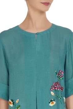 In a refreshing teal blue shade, this kurta features floral fine thread embroidery created by hand and machine. Perfect for summer festive events and more. 
Flared kurta
Machine and hand embroidery in thread and beads
Round neckline
Short sleeves
 - Aza Fashions Floral Embroidered Straight Kurta Top For Summer, Blue Embroidered Top With Resham For Summer, Summer Floral Embroidered Straight Kurta Top, Spring Blue Top With Resham Embroidery, Spring Resham Embroidered Straight Kurta Top, Blue Resham Embroidery Kurta For Summer, Blue Resham Embroidered Kurta For Spring, Blue Embroidered Kurta For Spring, Summer Blue Kurta With Resham Embroidery