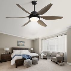 a bedroom with a bed, chair and ceiling fan in the middle of the room