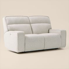 the reclining sofa is shown in white fabric and has two arms that are facing each other