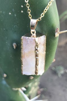 "Beautiful gold dipped and gold edged white raw druzy quartz pendant on gold colored clasp chain necklace. The rectangular prism shaped crystal is about 1\" long and 0.5\" wide. Please note that no two stones are alike and therefore color, shape and size may vary slightly. You can choose your necklace length from the drop-down menu. In case you would like a length besides the listed options, leave a note at checkout. Item will be shipped 1 - 2 business days after purchase. Back to my shop with i Gold Mineral Crystal Necklaces With Spiritual Style, Gold Mineral Crystal Spiritual Necklace, Gold Spiritual Mineral Crystal Necklace, Gold Quartz Necklace With Spiritual Style, Gold Necklaces With Rectangular Natural Stones, Gold Rectangular Necklaces With Natural Stones, Gold Necklace With Rectangular Natural Stones, Gold Minimalist Jewelry With Natural Stones, Minimalist Gold Jewelry With Natural Stones